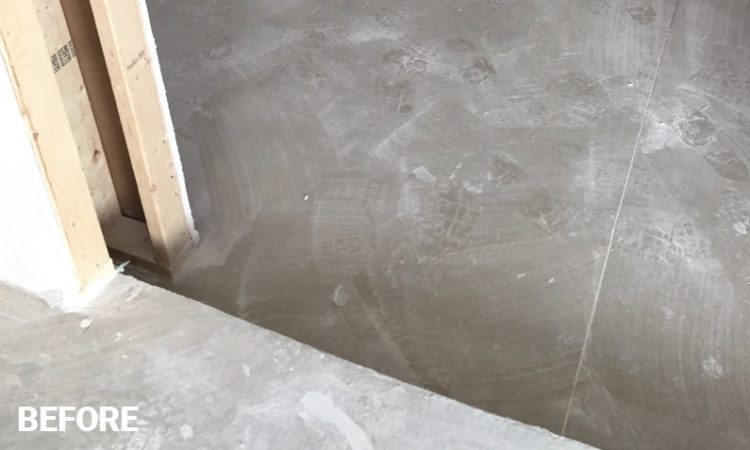 Unpainted Concrete Floor Covered in Drywall Dust