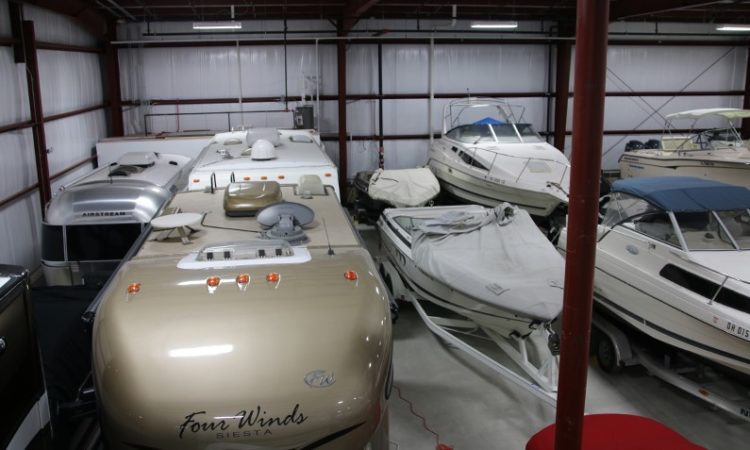 Boats and RVs in GK's Custom Polishing Climate-Controlled Indoor Storage Facility